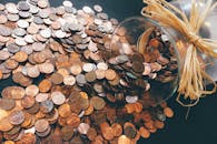 pexels-photo-259165-259165 Spilled jar of pennies creating a pattern of coins representing savings and finance.